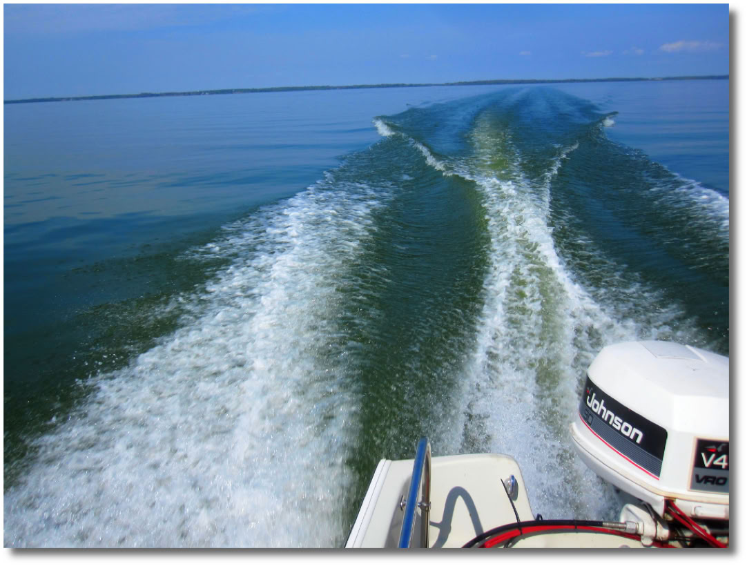 Boat wake on lake